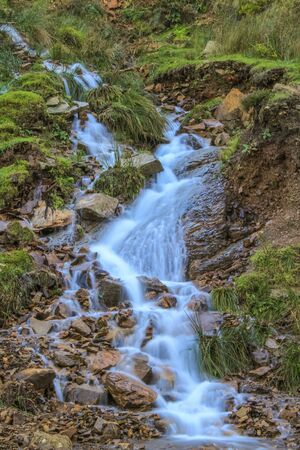 River flowing through a new path down the hillside at Langsett Reservoir, South Yorkshireの写真素材