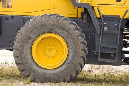 The rolling end of a front-end loader: The tire and wheel