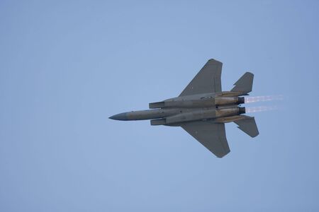 An F-15 Strike Eagle flies past with after-burners