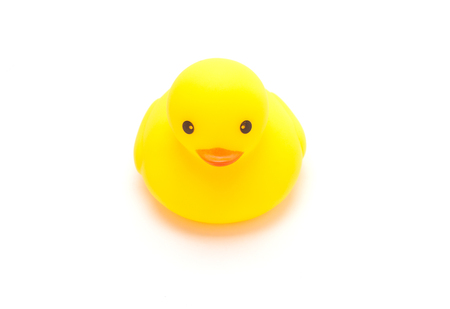 yellow rubber duck isolated on whiteの写真素材