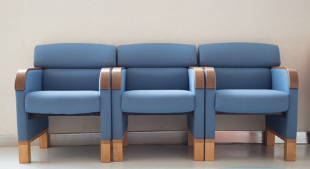 waiting room blue chairs, door on the floorの写真素材