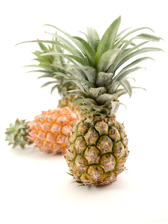 pineapple with slices isolated on whiteの写真素材