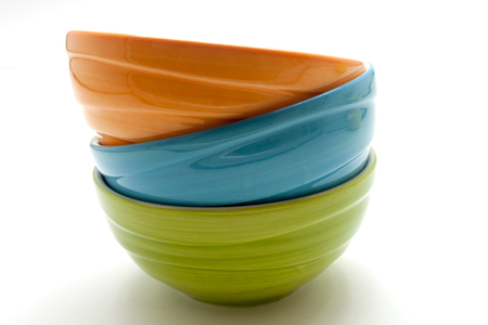 Small colorful ceramic bowl isolated over the white backgroundの写真素材