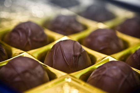 chocolate truffle in gold boxの写真素材