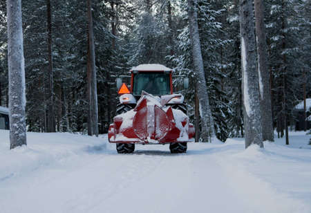 red tractor removal of snowの写真素材
