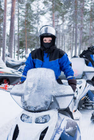 teen boys on snowmobileの写真素材