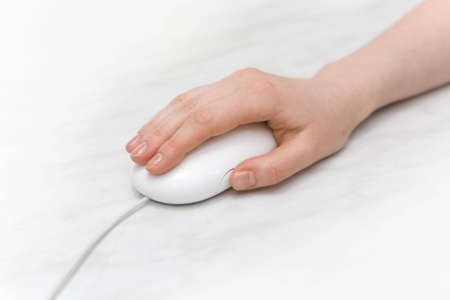 Hand on white keyboard. macro.