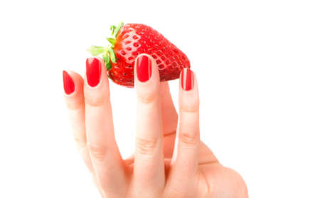 Beautiful strawberries in womans handの写真素材