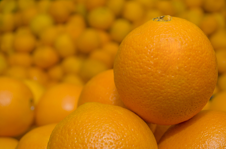 beautiful tangerines on an orange background, a fruit mixの写真素材