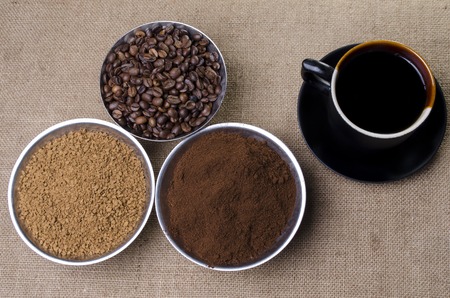 ground black coffee in a cup with a saucerの写真素材