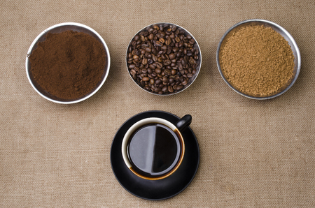 ground black coffee in a cup with a saucerの写真素材