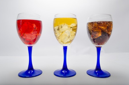 fresh juice with ice on a white background in glassesの写真素材