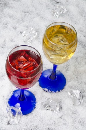 fresh juice with ice on a white background in glassesの写真素材