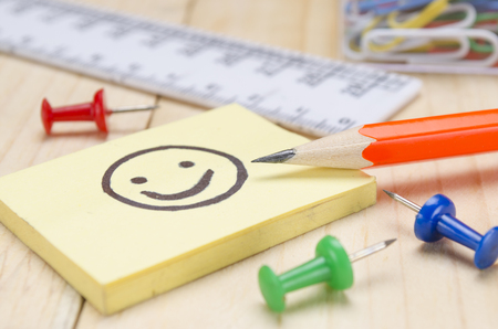 school supplies on a wooden school deskの写真素材
