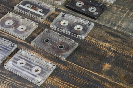 music on the old magnetic cartridge on a wooden tableの写真素材