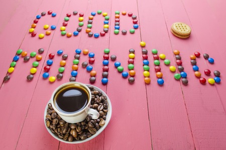 bright candies on a wooden pink tableの写真素材