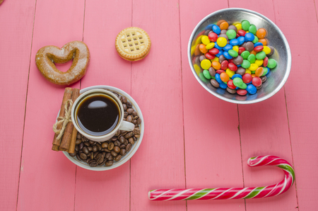 bright candies on a wooden pink backgroundの写真素材