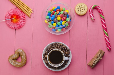 bright candies on a wooden pink backgroundの写真素材