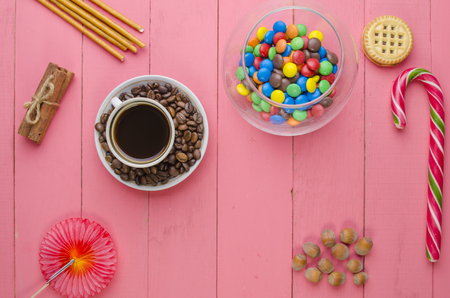 bright candies on a wooden pink backgroundの写真素材
