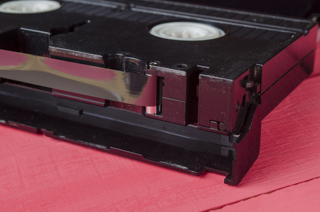the magnetic cartridge for the tape recorder on a wooden tableの写真素材