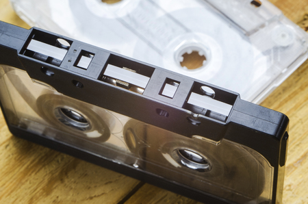 the magnetic cartridge for the tape recorder on a wooden tableの写真素材