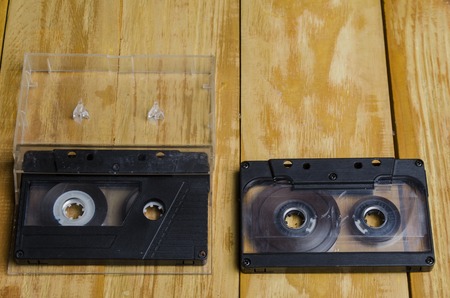 the magnetic cartridge for the tape recorder on a wooden tableの写真素材