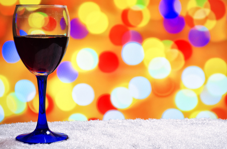 glass of hot wine with seasonings on a wooden tableの写真素材