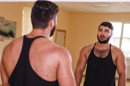 the guy goes in for fitness in the gymの写真素材