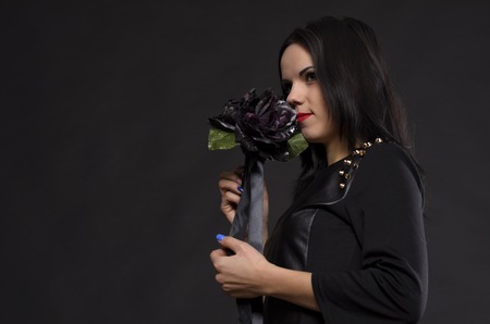 young girl in a black dress in the studioの写真素材