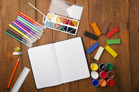 Items for children's creativity on a wooden tableの写真素材