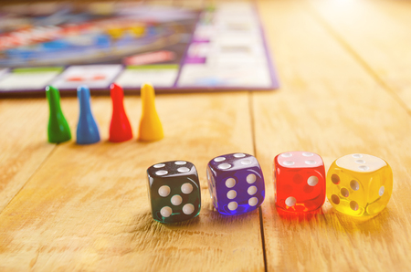 board game with cubes on a wooden background