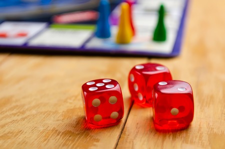 board game with cubes on a wooden background