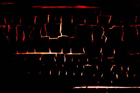 old structural wooden board burning from the inside