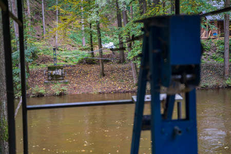 metal cable stretched across the river is intended for crossingの写真素材