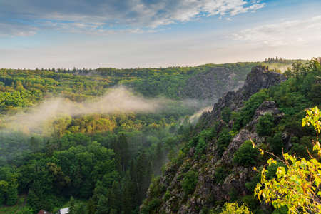 Beautiful sunrise in Czech mountains with fogの写真素材