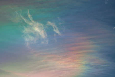 An iridescent cloud in a blue skyの写真素材