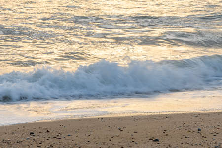 Sandy beach along the Atlantic coast in a summer evening.