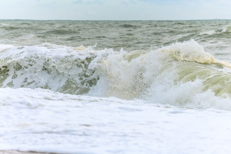 Waves breaking on the beach at the edge of the Atlantic Ocean near Sables d'Olonne in France.の写真素材