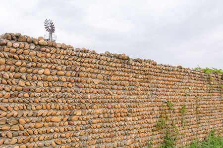 Pattern brown color of real stone wall surface, background, from Provence, Franceの写真素材