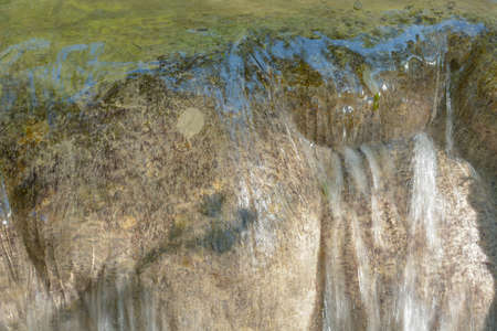 The tufa waterfall near Arbois. Crystal clear waterfall, powerful waterfall.