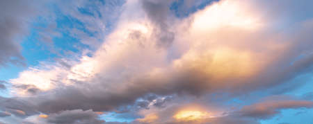 Glowing sky at dusk on a fall evening. Banner, panoramic.