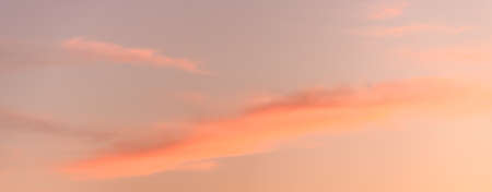 Glowing sky at dusk on a fall evening. Banner, panoramic.