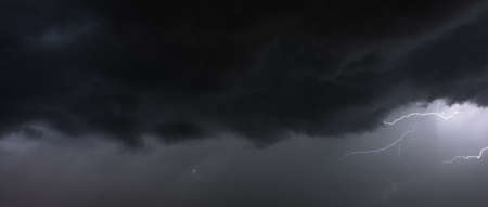 Electric flash at night during a thunderstorm. Extreme climate.