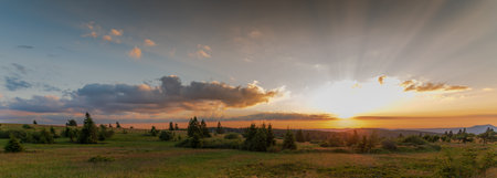 Evening sunset over the mountains in spring. Panoramic, panoramic. Vosges, Alsace, France.