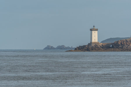 The Kermorvan lighthouse on the edge of the Iroise Sea. Le Conquet, Brest, Finistere, Brittany, France, Europeの写真素材
