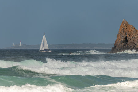 Sailboat sailing offshore on the Atlantic Ocean. Camaret sur mer, Crozon, Finistere, Brittany, Franceの写真素材