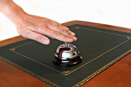 A service bell on a hotel reception desk