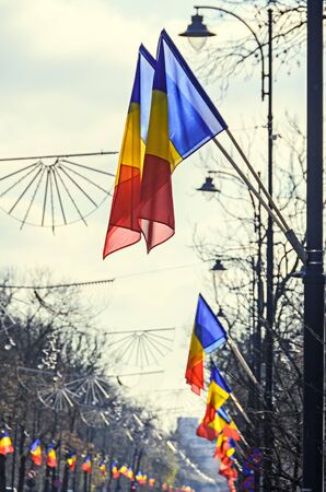 Romanian Flags in the wind, National Day of Romania, Kisselleff Avenue, blue sky close up.の写真素材