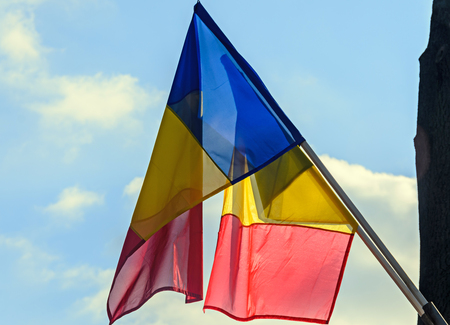 Romanian Flag in the sun, National Day of Romania, blue sky close up.の写真素材