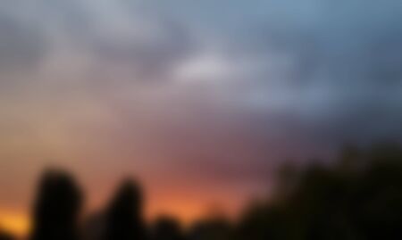 Orange blue blurred pastel texture, background colors, clouds sky colored dramatic landscape sceneの写真素材